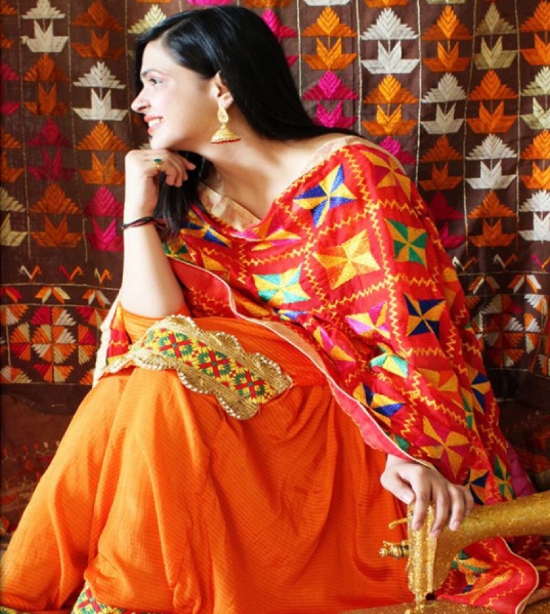 Orange salwar suit with phulkari red dupatta